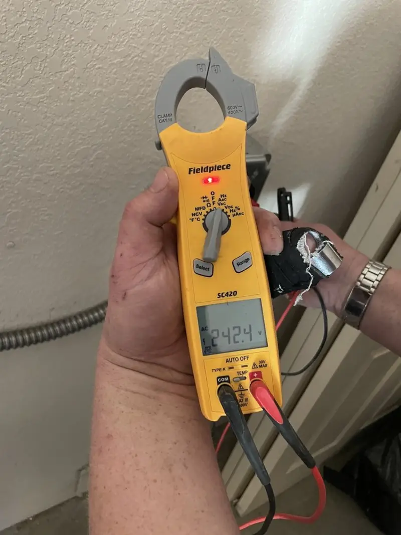 Voltage testing with clamp meter during Ceiling Fan Installation in Mandeville